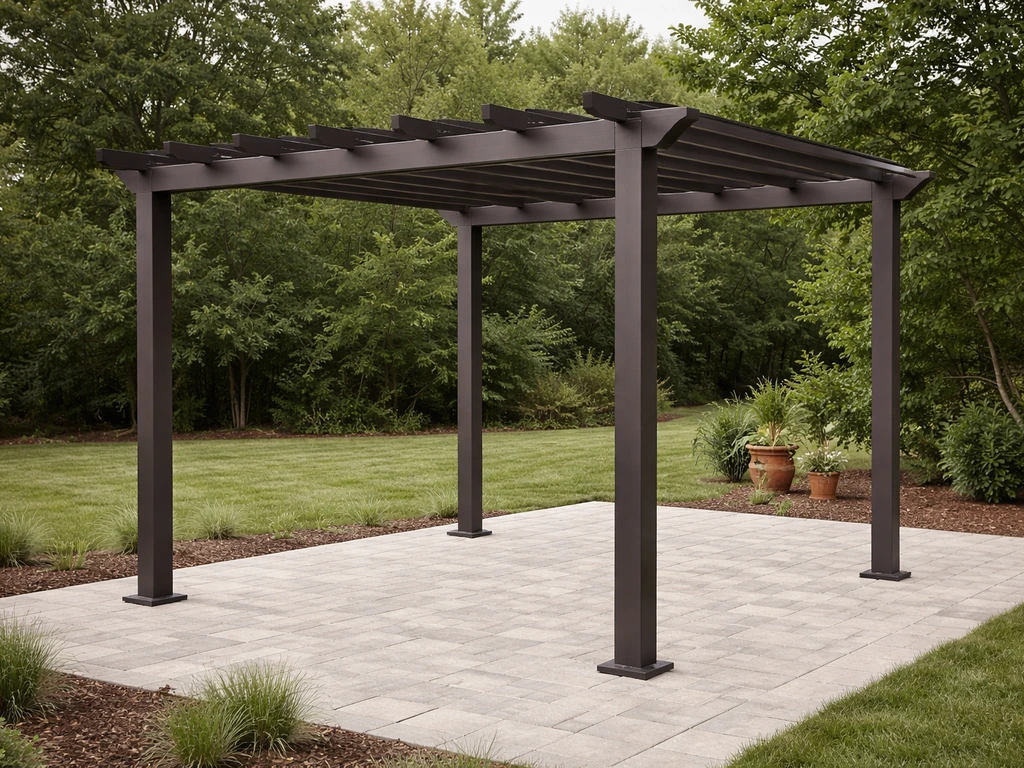 Freestanding pergola with four anchored posts and installed roof beams over a detached patio.